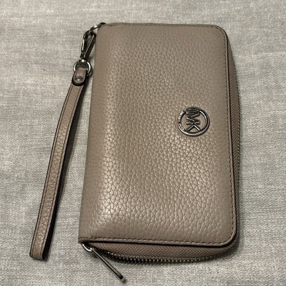 NWOT Michael Kors Wristlet wallet color tan or beige tall(4”a quarter wide7”1/2) - Picture 1 of 7